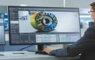 Industrial engineer working on a complex 3D mechanical model on computer